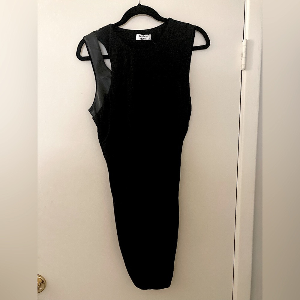 Bailey 44 Black NWOT Bodycon Style Form Fitting M With Detailed Cut Outs.